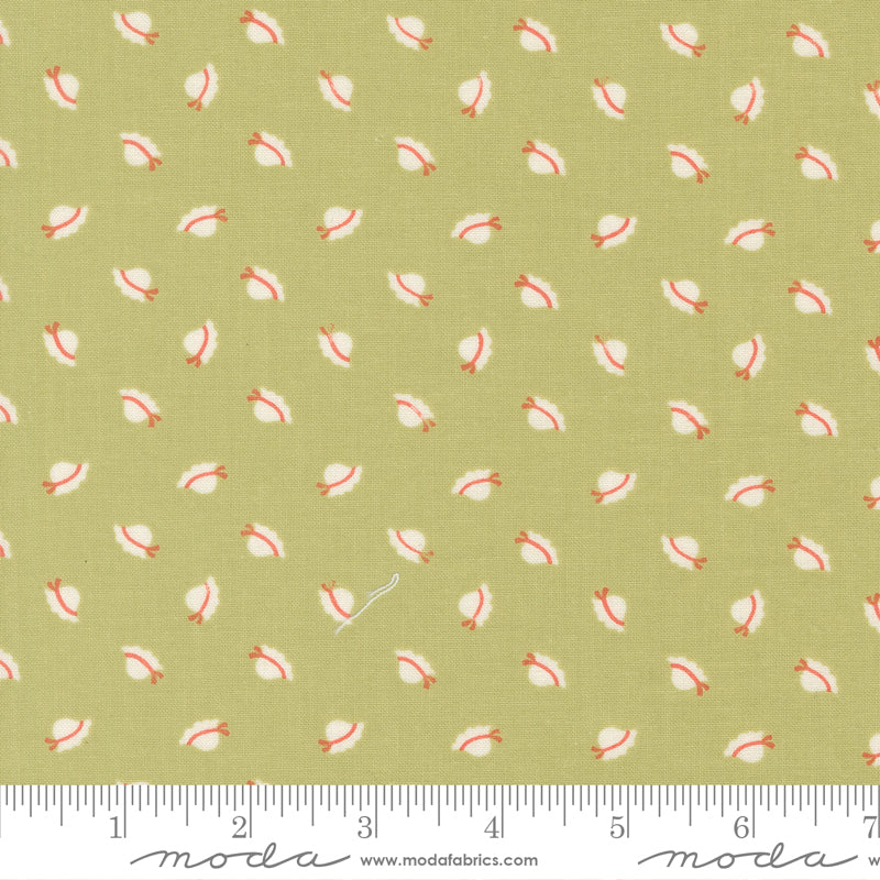 Fabric with small shell pattern on a green background, featuring ruler and Moda label.