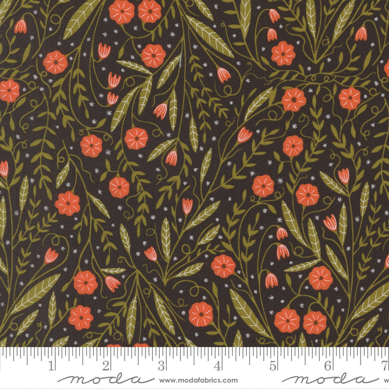 Floral pattern with red flowers and green leaves on a dark background, featuring Moda label and ruler for scale.
