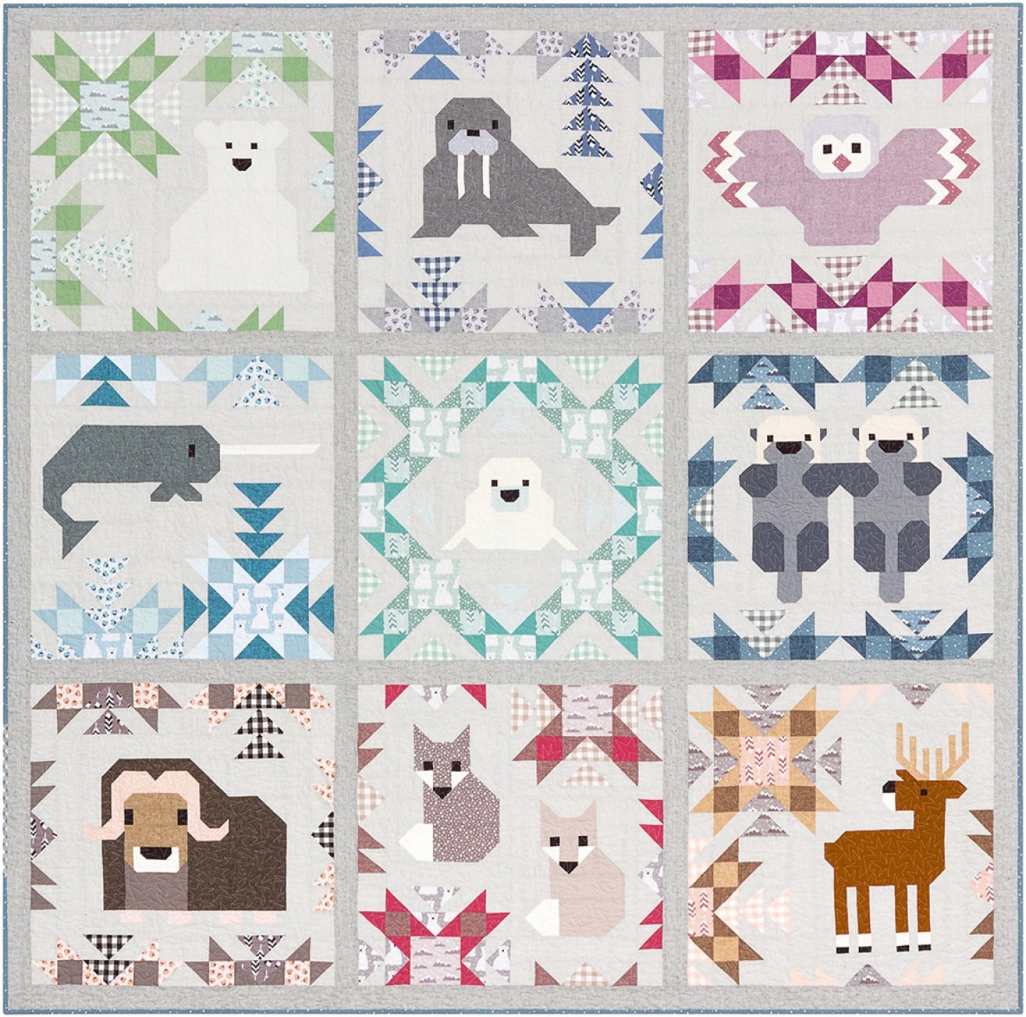 Mockup of North Stars Quilt featuring a grid of Actic Animals on a cream background
