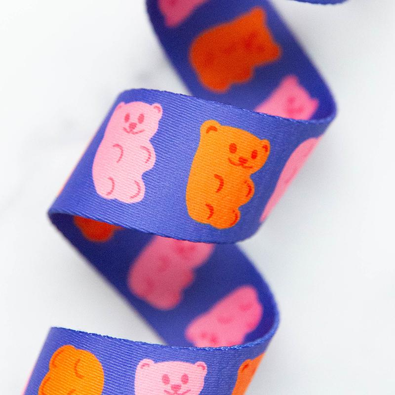 Purple webbing with gummy bear patterns 