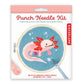 Kikkerland punch needle kit packaging with axolotl design on a white background