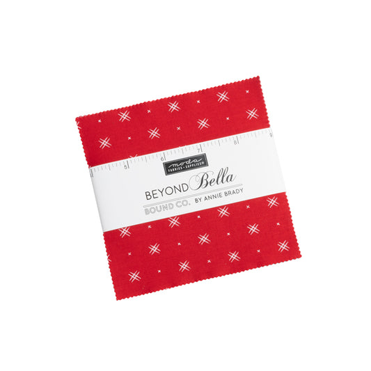 Cover of Moda charm pack. The top fabric is red with small geometric details.