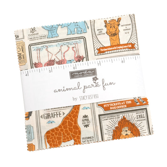 Top down view of the Animal Park fun charm pack by Stacy Iest Hsu for Moda Fabrics. The top fabric shows circus animals.