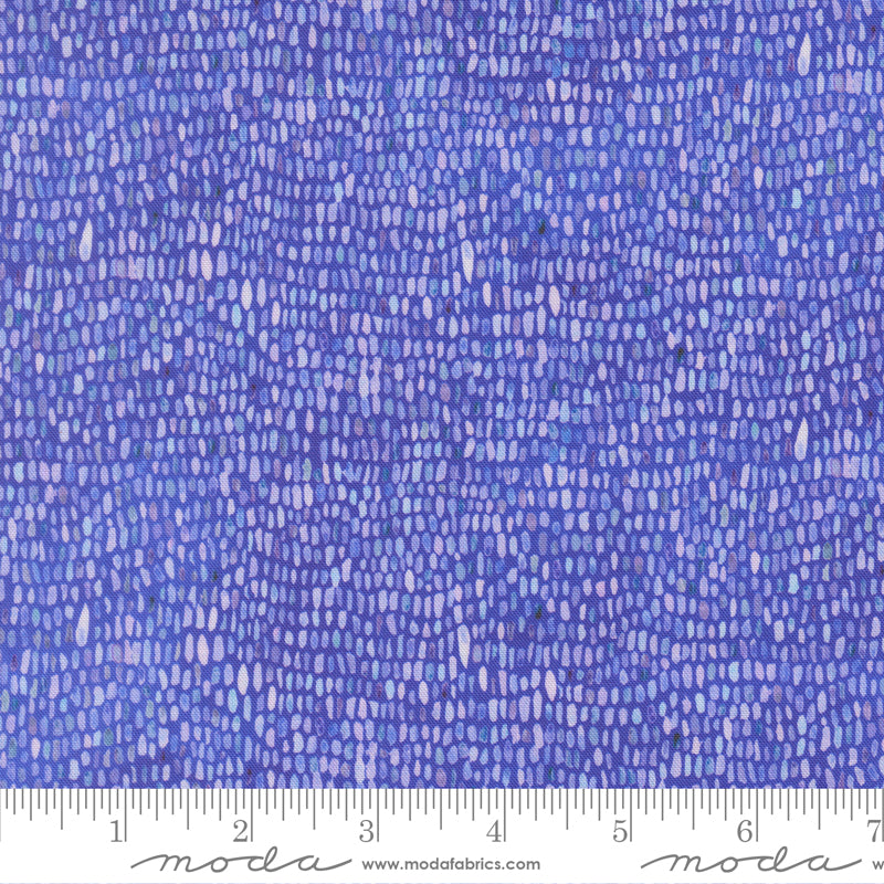 Blue-purple patterned fabric designed to look like a paint palette with a ruler for scale.