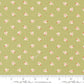 Fabric with small shell pattern on a green background, featuring ruler and Moda label.