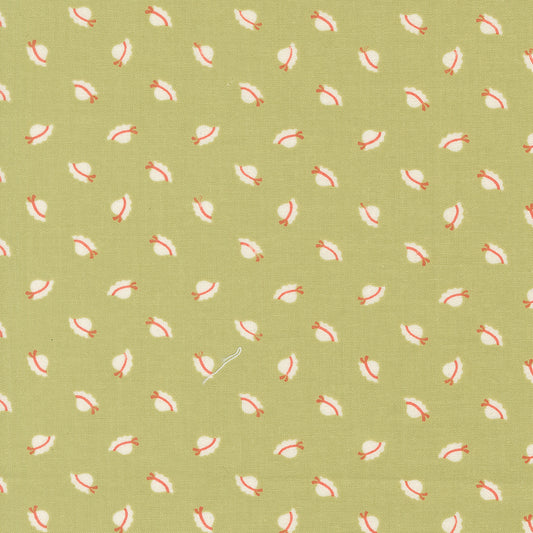 Pattern of small red and white sunbonnets on a green background