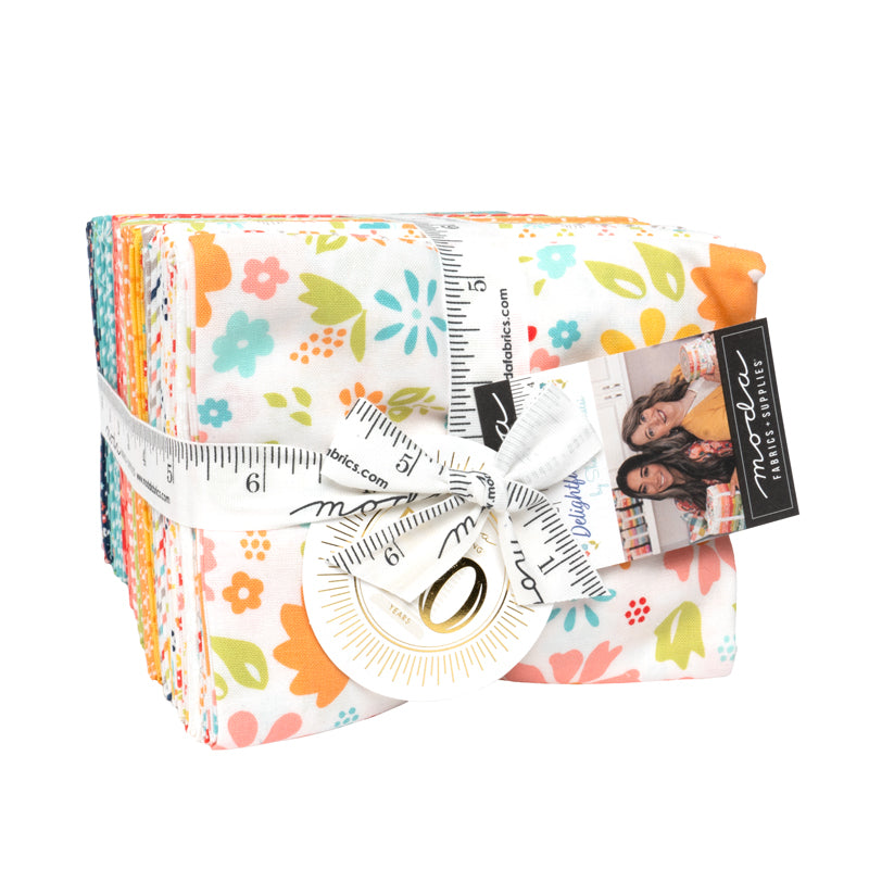 Stock image of the Delightfully Yours Fat Quarter bundle wrapped in a white ruler ribbon.