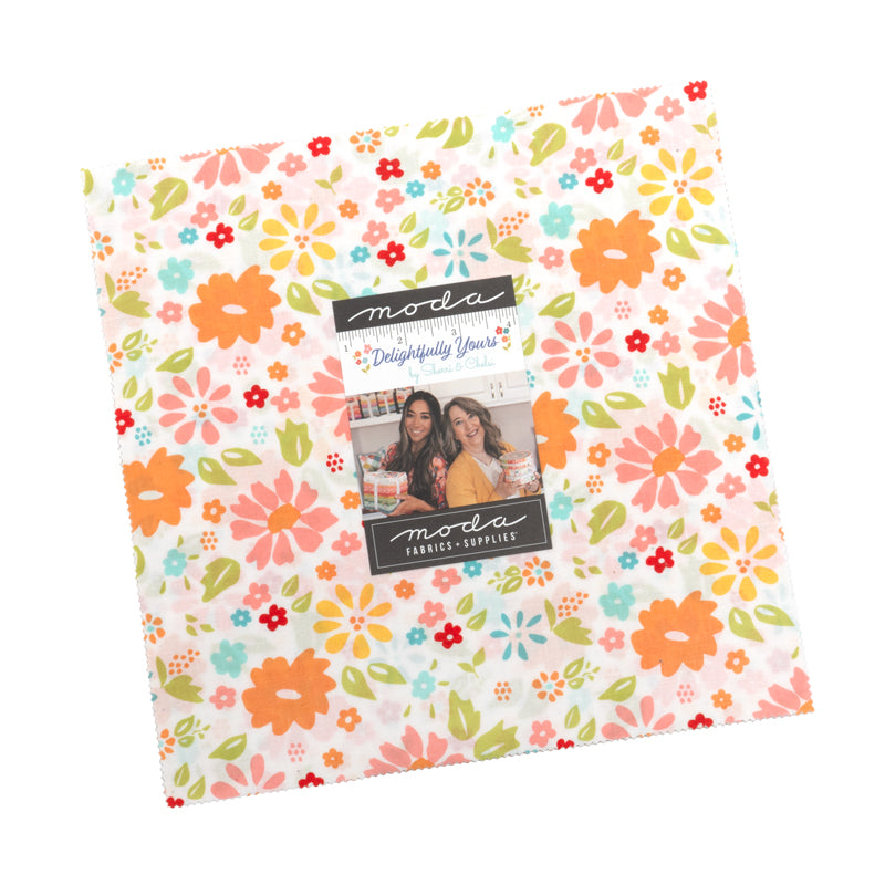 Floral patterned fabric with Moda label on a white background