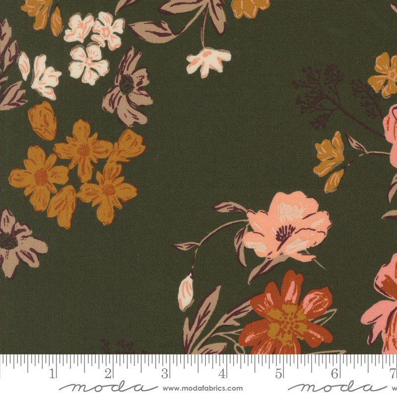 Floral fabric pattern with a ruler at the bottom on a green background