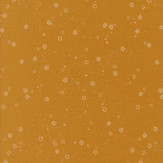 Pattern of small stars on a caramel background