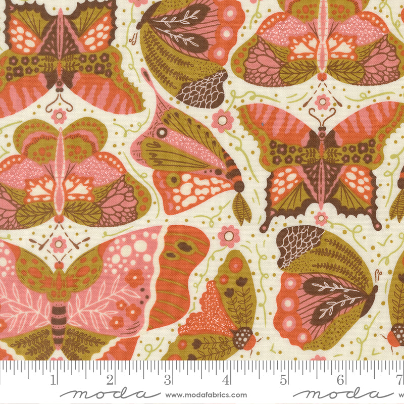 Butterfly pattern fabric with Moda label and ruler at the bottom