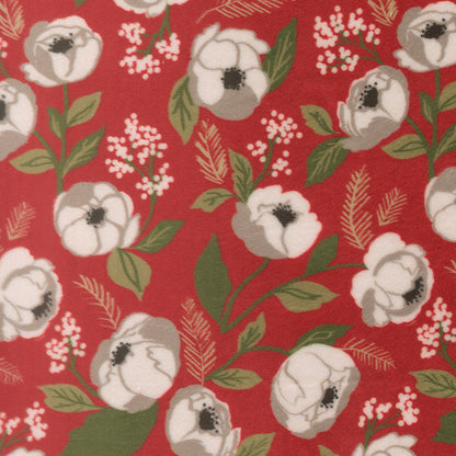 Polyester fabric swatch with white roses and Christmas foliage on a red background.