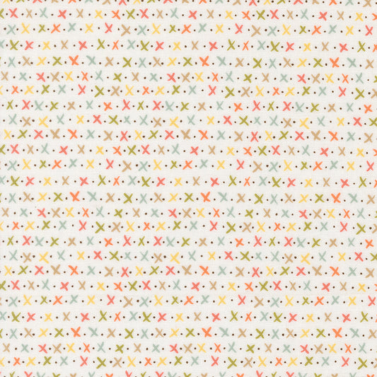 Pattern of small crosses and dots on a light background