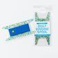 Picture of an acrylic quilt binding spool with teal, blue, and gold dots.