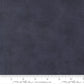 Tonal dark blue color cotton swatch with a ruler for scale