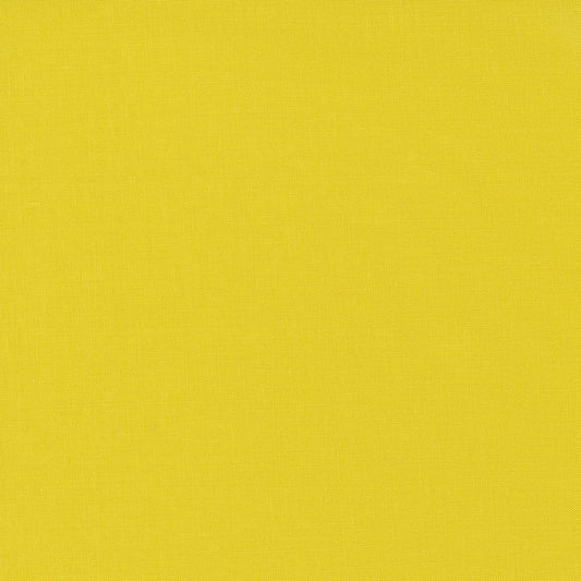 A fabric swatch of a yellow-green solid quilting cotton