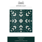 Artemis quilt with geometric pattern on a white background, featuring Alderwood Studio logo.