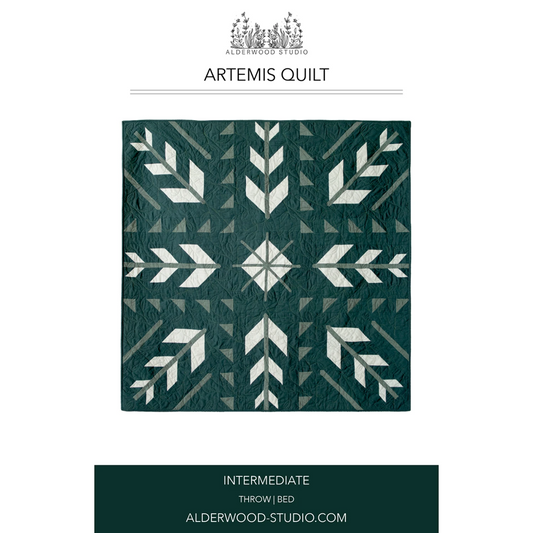 Artemis quilt with geometric pattern on a white background, featuring Alderwood Studio logo.