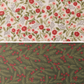Two fabric swatches of quilting cuddle. The first is a floral on white, and the second is holly on a deep green.