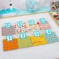 A set of fabrics clipped with the Alphaclippies and sitting on a design board.