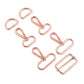 Set of rose gold bag hardware on a white background