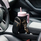 Black sample with a pink water bottle on a car seat