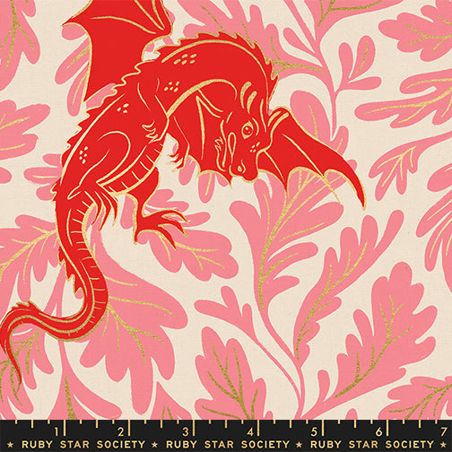 Pattern of canvas fabric with red dragons and pink and metallic gold leaves on a light background with a ruler for scale.