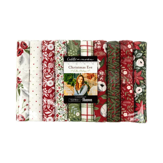 A package of ten quilting cuddle fat quarters in Christmas or winter patterns of red white and green.