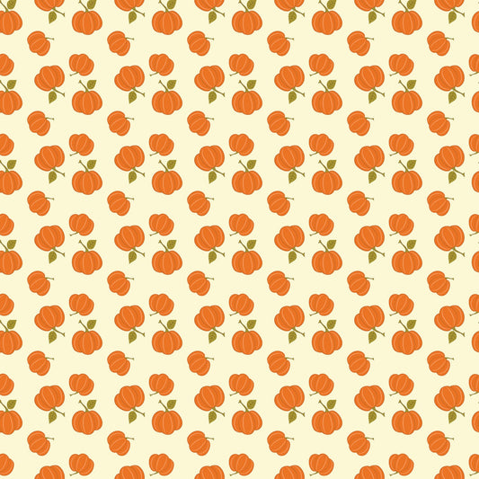 A cream colored fabric printed with a cute toss of bright orange pumpkins.